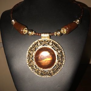 Beaded choker with large brown stone medal…
